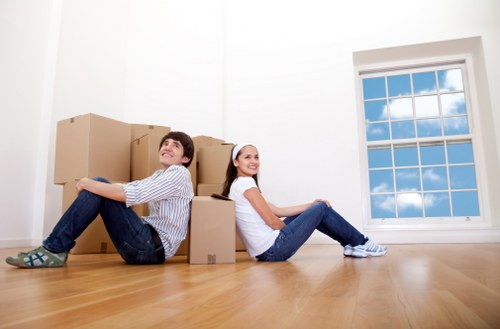 Professional moving truck service team assisting relocation